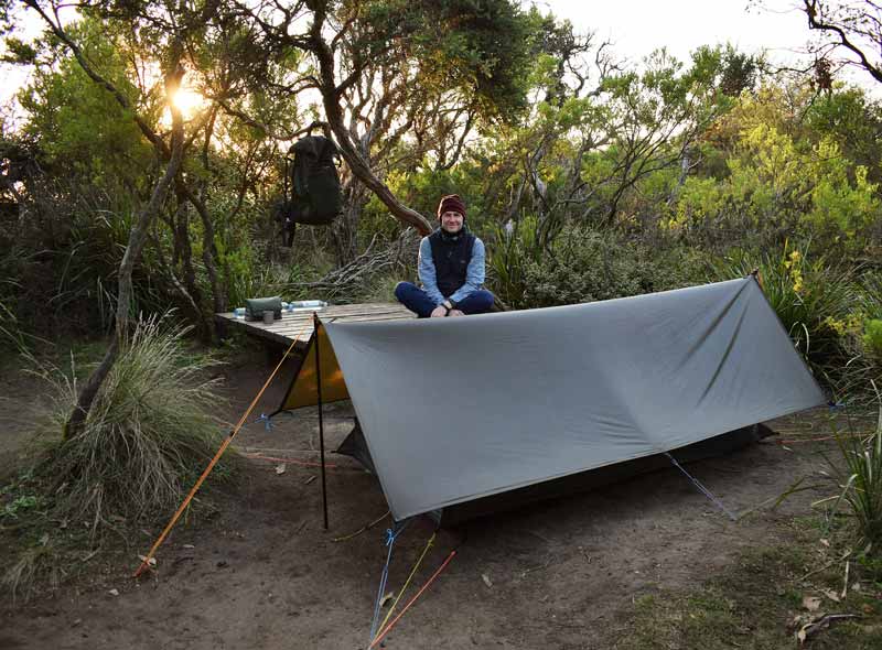 Richard poses in front of his ultralight camp during one of escapades into the bush.